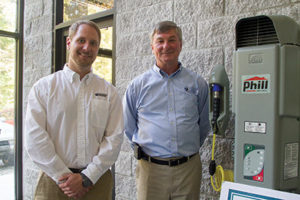 In 2004, Matt Hyde talked his father Ken into coming out of retirement so the two could start their new business Phoenix Energy. The company recently moved to Pell City. The two men stand next to a natural gas fueling station at their new store in Pell City. Brian Schoenhals/The Daily Home 